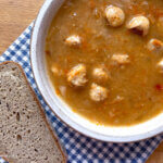 bowl with Czech sauerkraut soup and bread