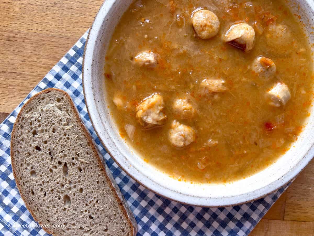 bowl with Czech sauerkraut soup and bread