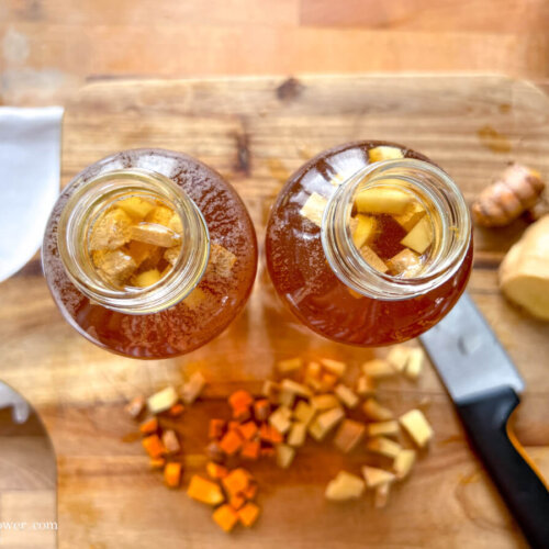 two bottles of ginger & turmeric kombucha