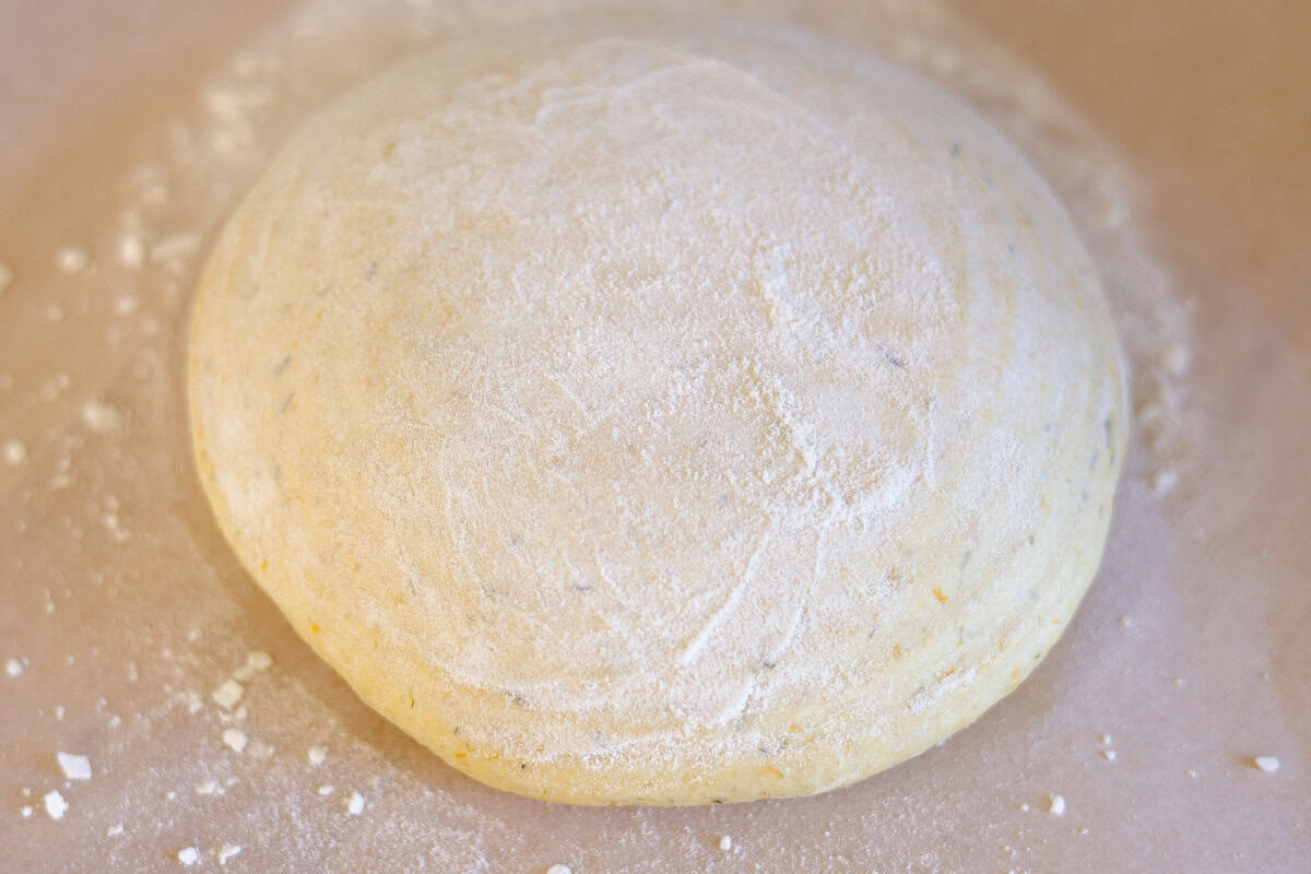dandelion bread dough in a floured surface