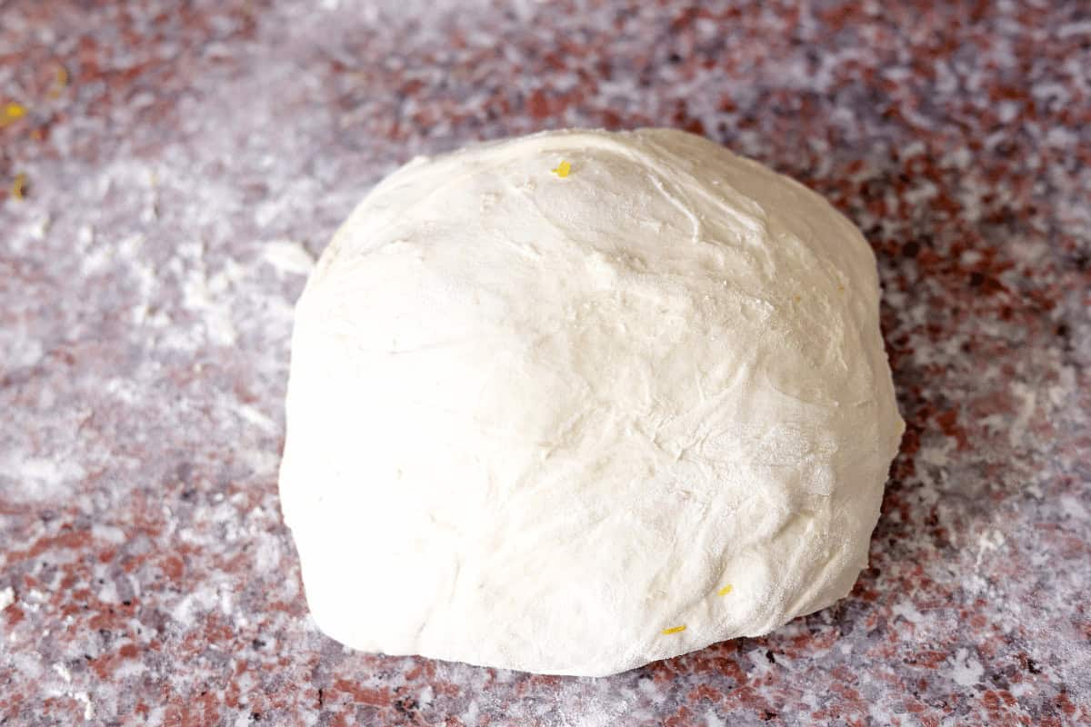 shaped dough in a floured surface