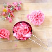 rose petals in a measuring cup