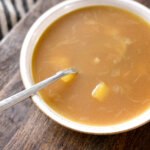 czech garlic soup in a bowl with a spoon