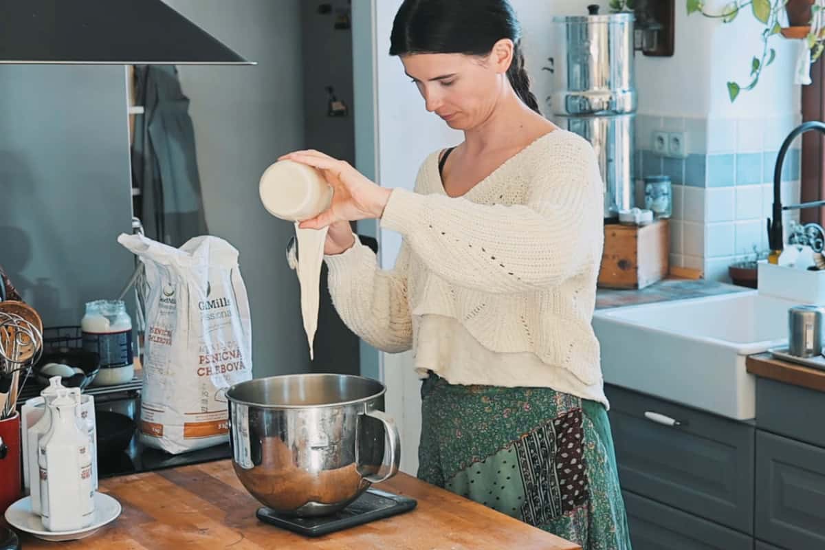 pouring sourdough into the bowl