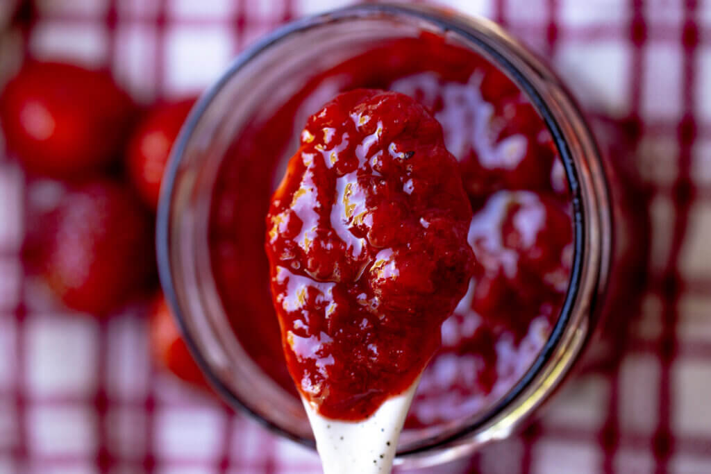 a spoon filled with jam
