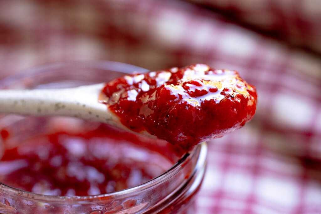 a spoon of strawberry jam