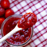 a jar of jam with strawberries