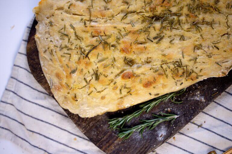 sourdough focaccia with garnished with rosemary on top