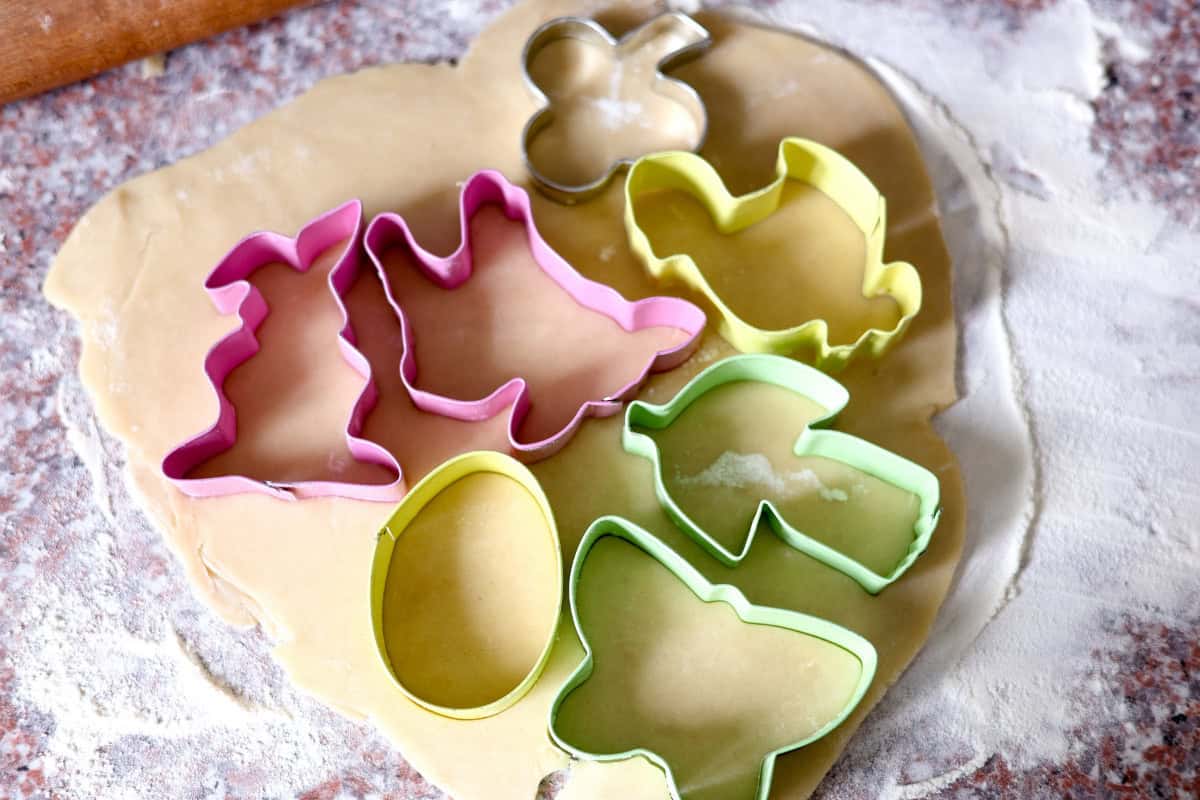cutting dough with cookie cutters