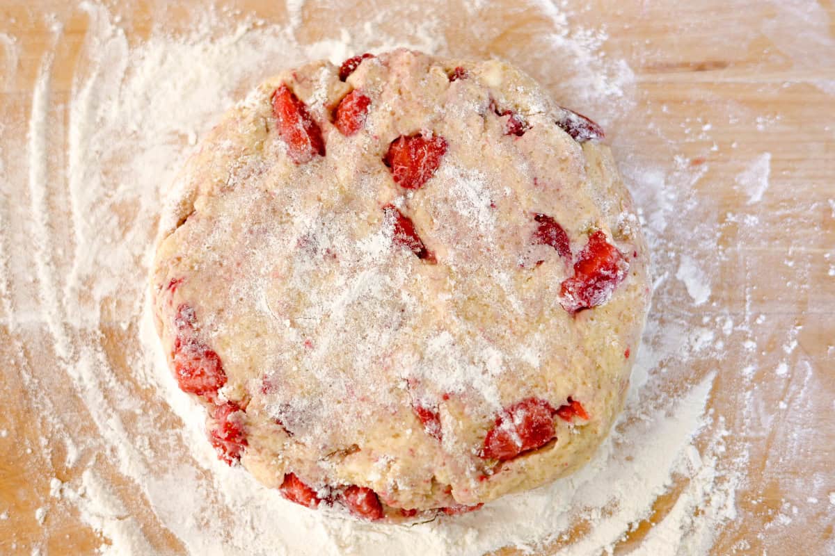 sourdough with strawberries on a floured surface